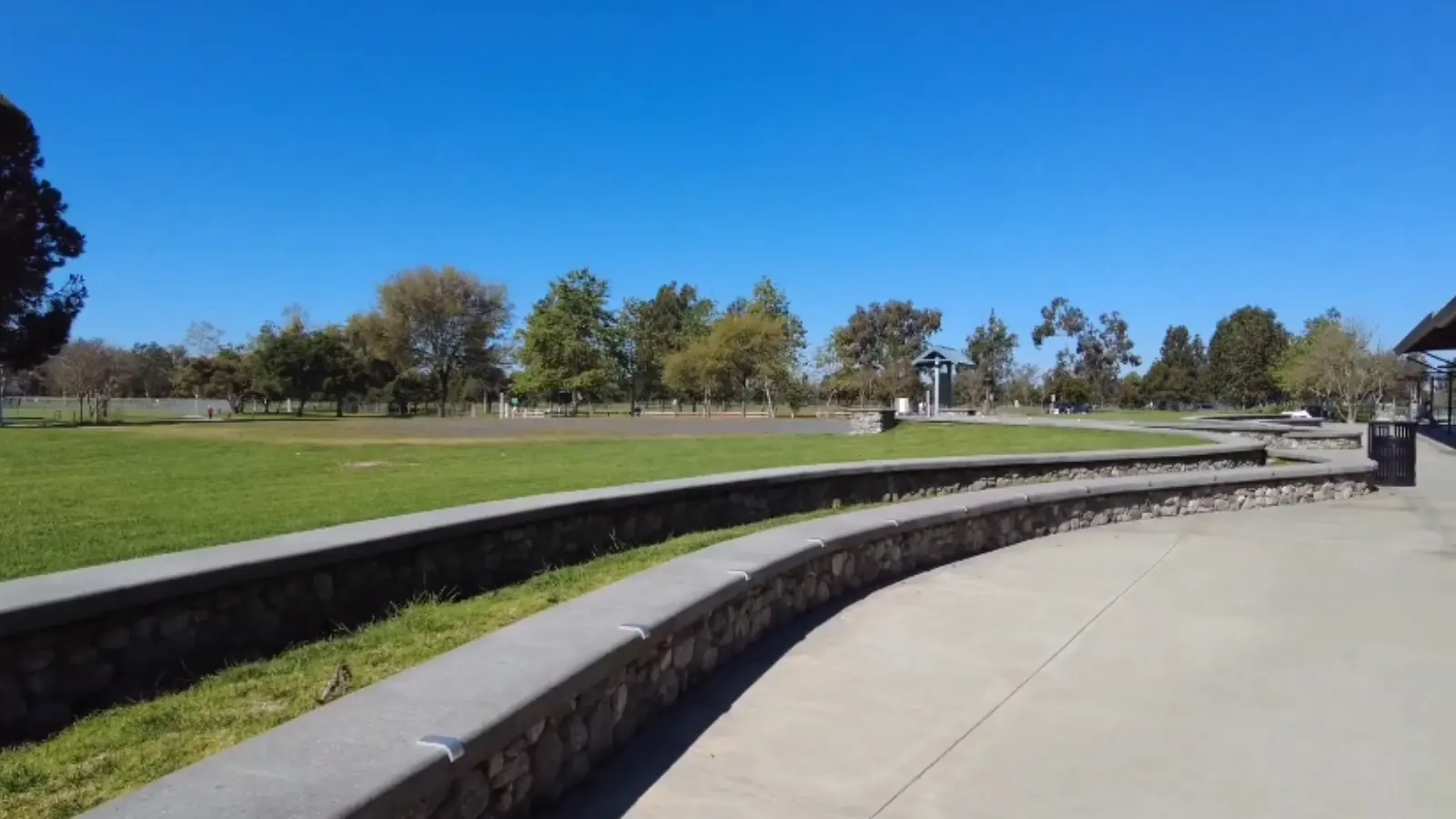 Open lawns and trees at Mile Square Regional Park in Fountain Valley, CA