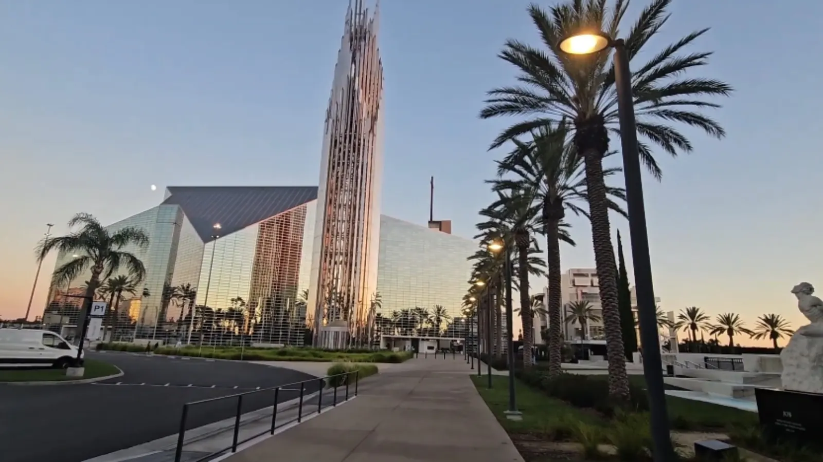 Christ Cathedral glass tower and campus in Garden Grove, CA at dusk