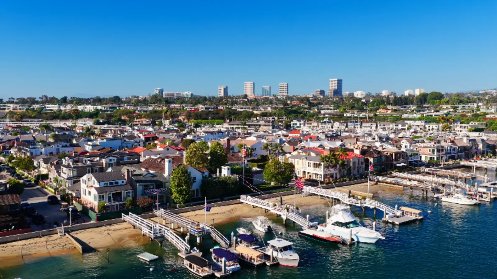 Aerial view of Newport Harbor, Lido Isle docks and homes in Newport Beach, CA